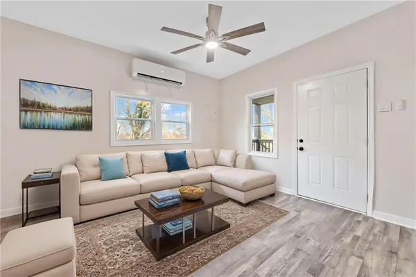 a living room with furniture and a large window