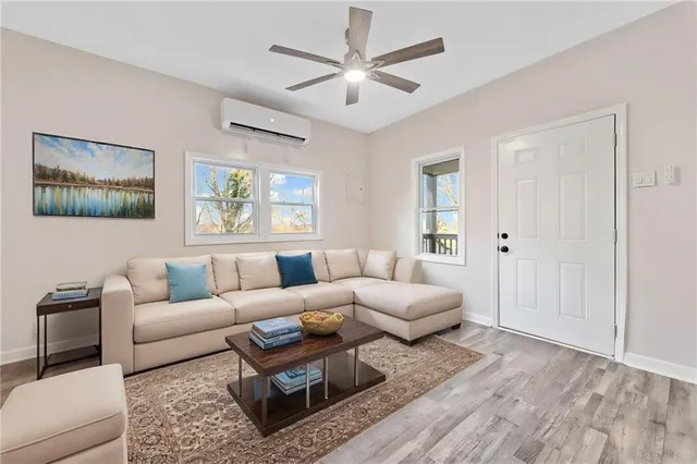 a living room with furniture and a large window