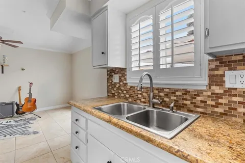 a kitchen with a sink and a window