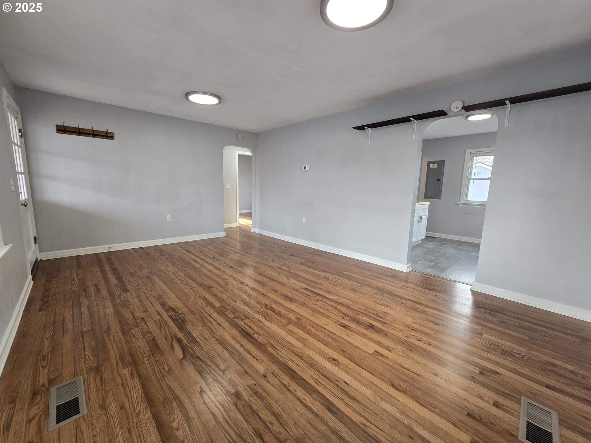 210 Southwest 3rd Street Hermiston, OR 97838 - Photo 12 of 24 wooden floor in an empty room with a window