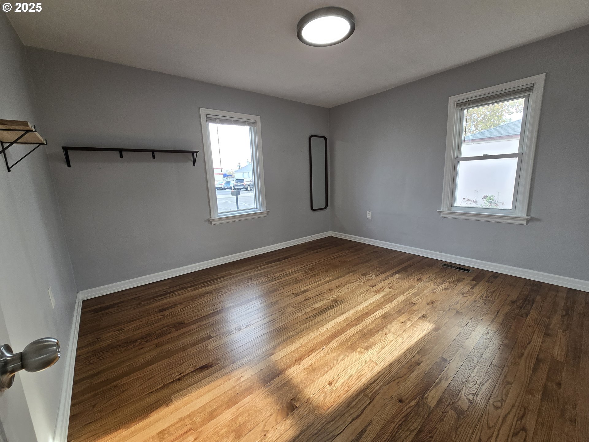 210 Southwest 3rd Street Hermiston, OR 97838 - Photo 19 of 24 a view of empty room with wooden floor and fan