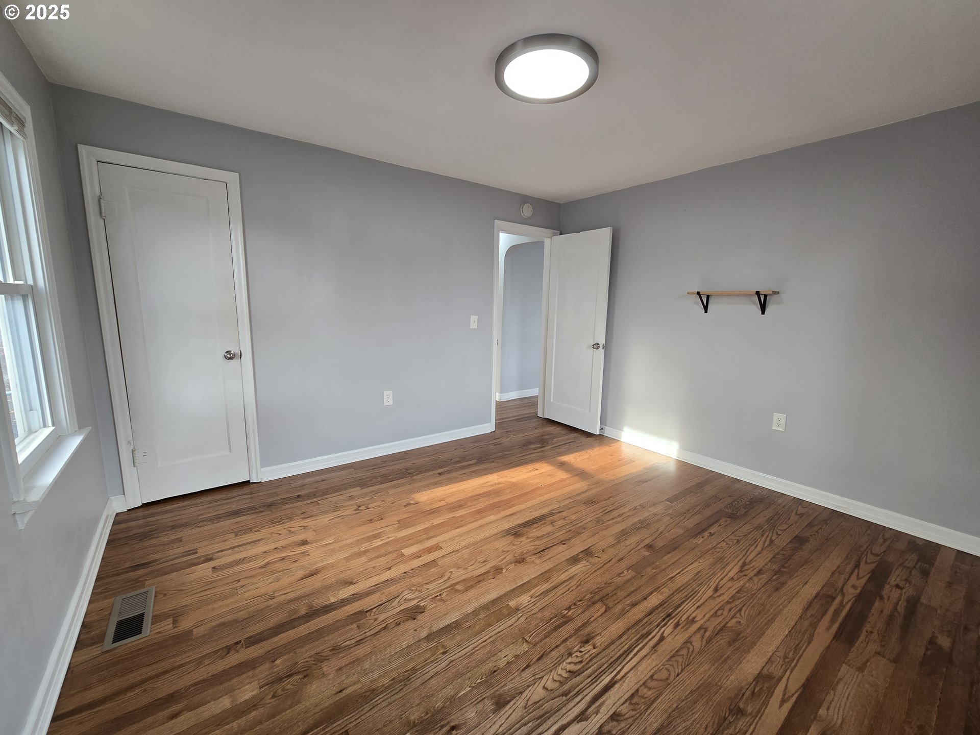 210 Southwest 3rd Street Hermiston, OR 97838 - Photo 20 of 24 a view of empty room with wooden floor