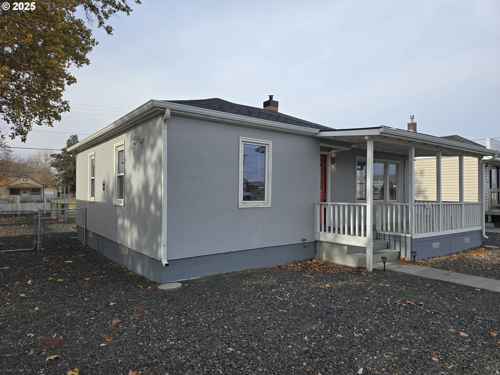 210 Southwest 3rd Street Hermiston, OR 97838 - Photo 3 of 24 a view of a house with a yard and deck