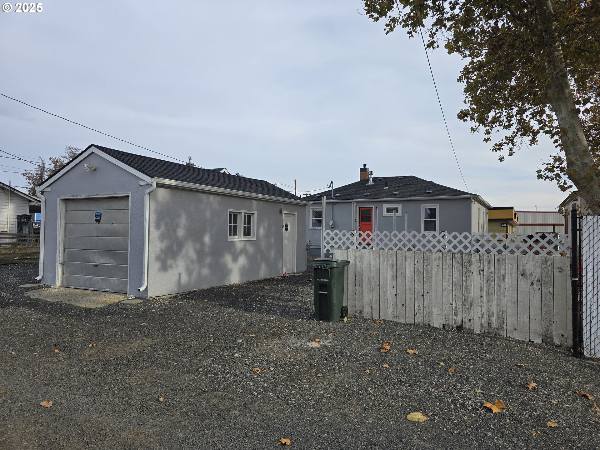 210 Southwest 3rd Street Hermiston, OR 97838 - Photo 6 of 24 a view of a house with a yard and garage
