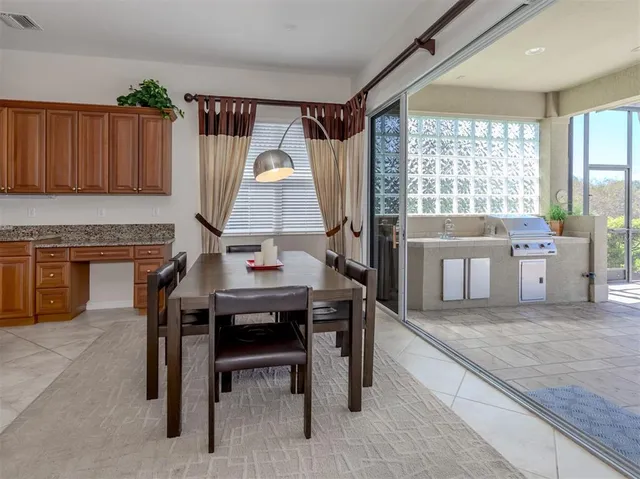 a view of a dining room with furniture and window