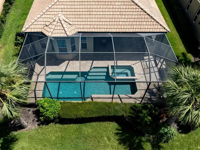 a swimming pool with outdoor seating