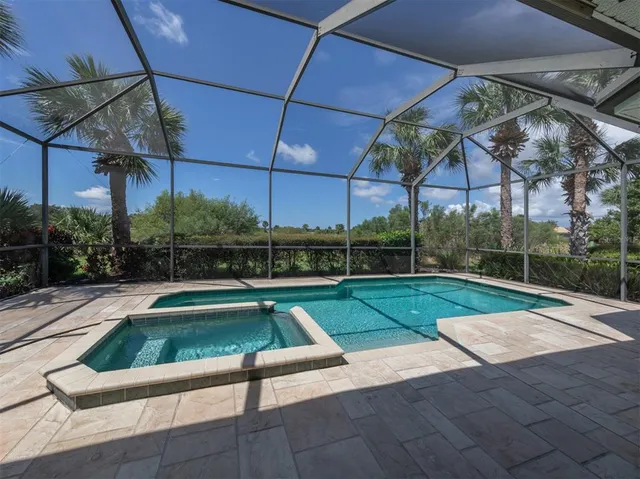 a view of a backyard with swimming pool