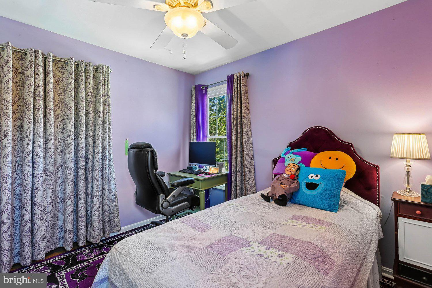 14822 Rose Trellis Place Silver Spring, MD 20906 - Photo 36 of 65 a bedroom with a bed and a chandelier