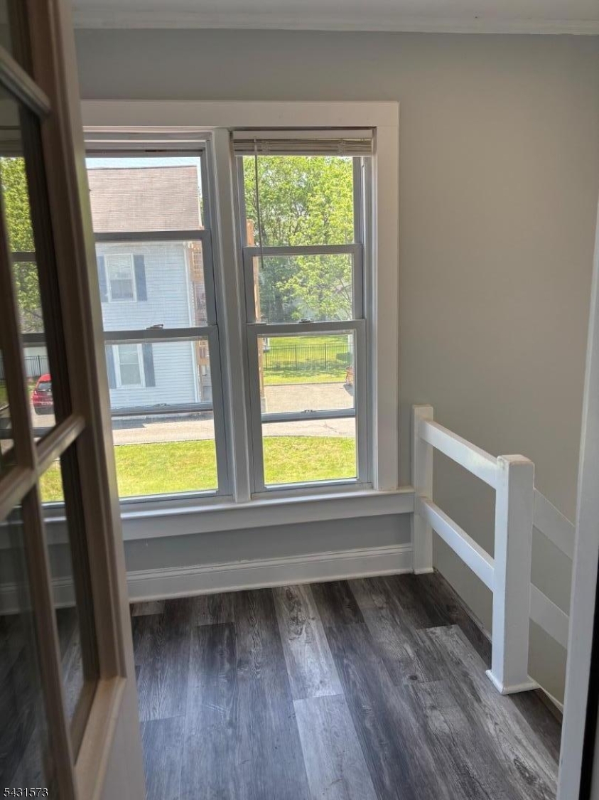 358 Woodland Road, Unit 2 Madison, NJ 07940 - Photo 48 of 50 a view of an empty room with a window and wooden floor