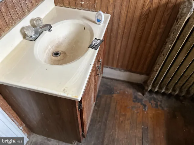 a bathroom with a sink and mirror