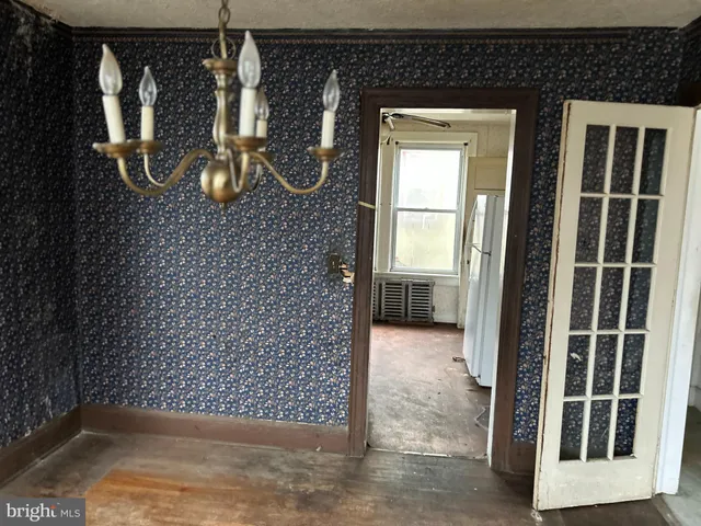 a view of a door and a window