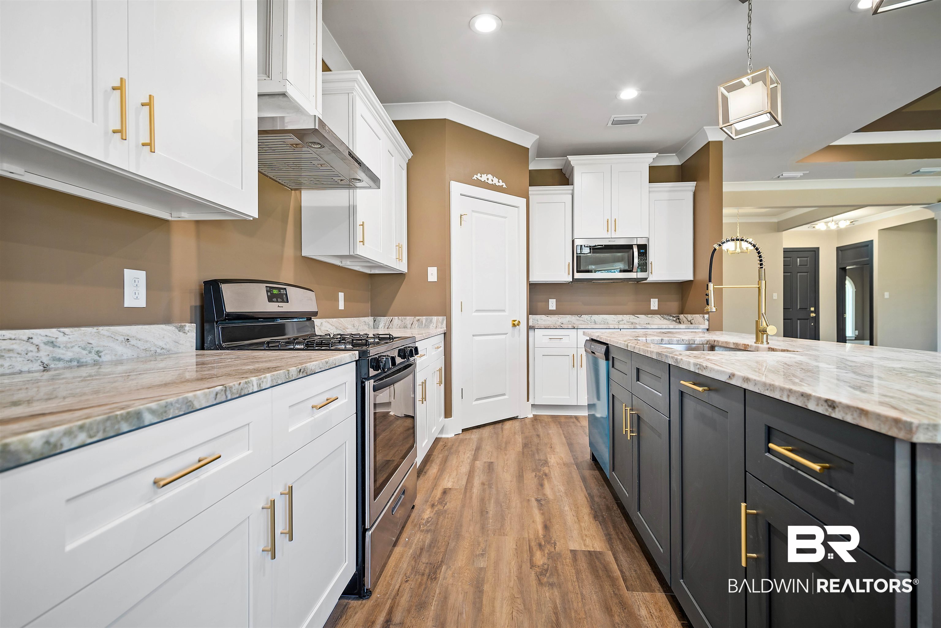 188 Hampton Ridge Mobile, AL 36608 - Photo 10 of 37 Kitchen featuring sink, white cabinetry, crown molding, stainless steel appliances, pendant lighting, large pantry.