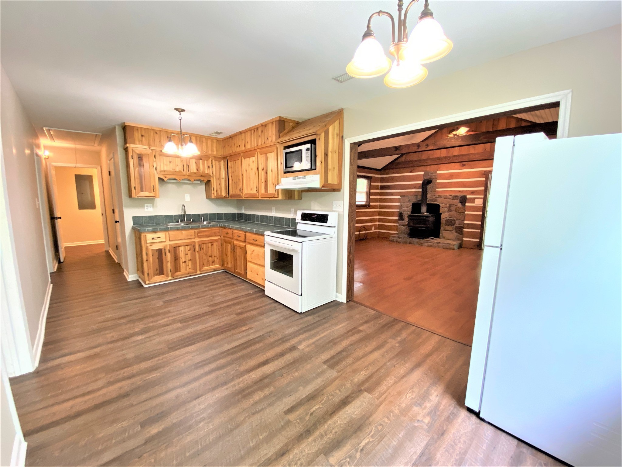 1035 West Point Road Lawrenceburg, TN 38464 - Photo 11 of 42 a kitchen with a refrigerator and a stove top oven