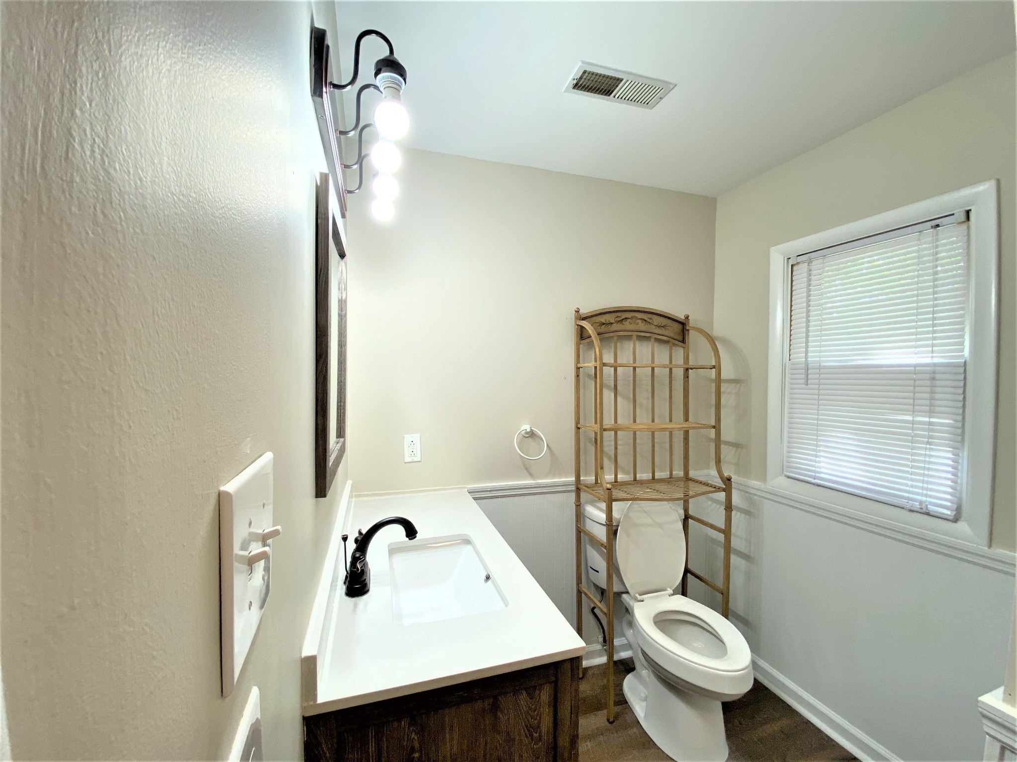 1035 West Point Road Lawrenceburg, TN 38464 - Photo 24 of 42 a bathroom with a toilet a sink and mirror