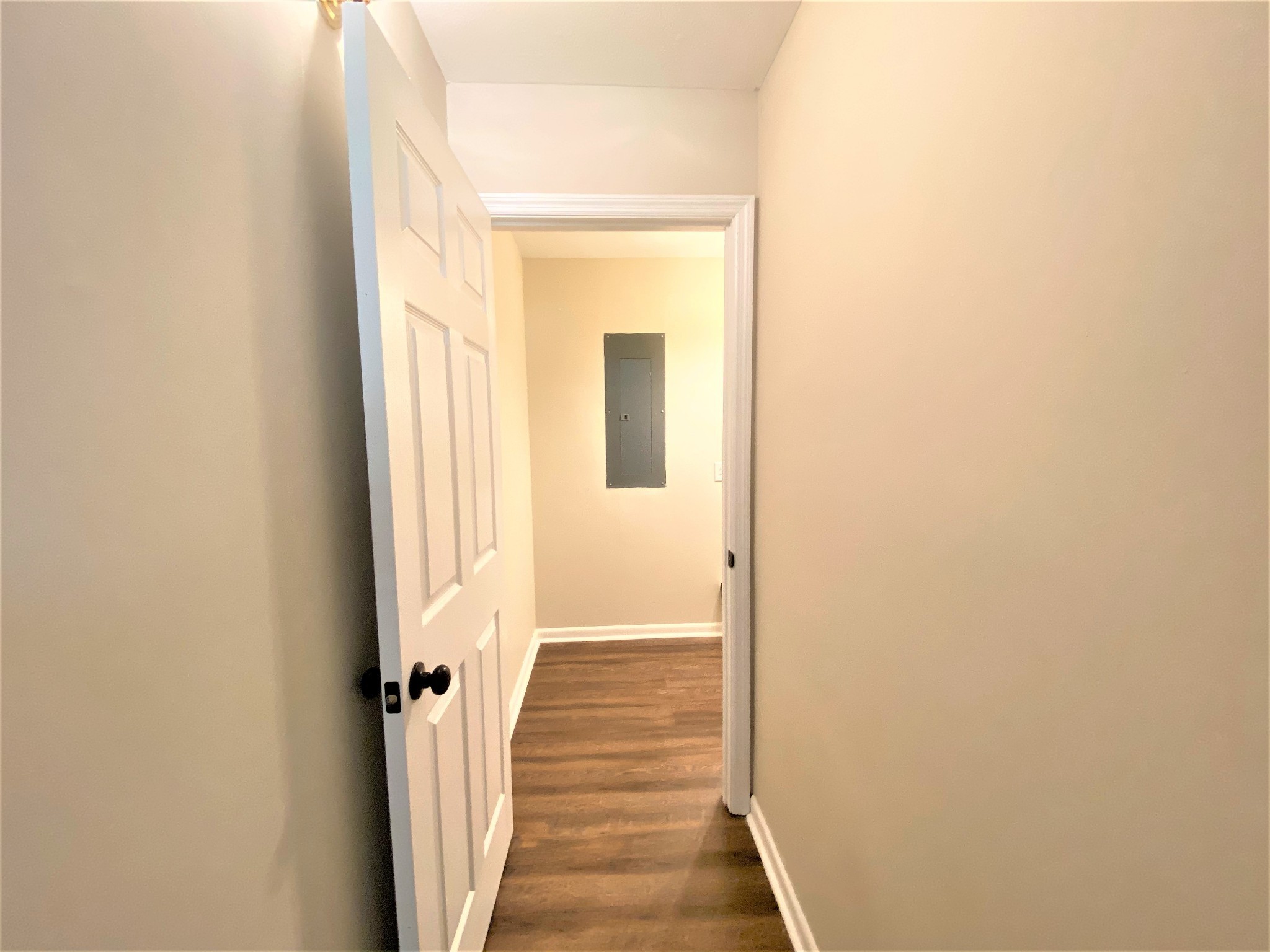1035 West Point Road Lawrenceburg, TN 38464 - Photo 27 of 42 a view of a hallway with wooden floor and a bathroom