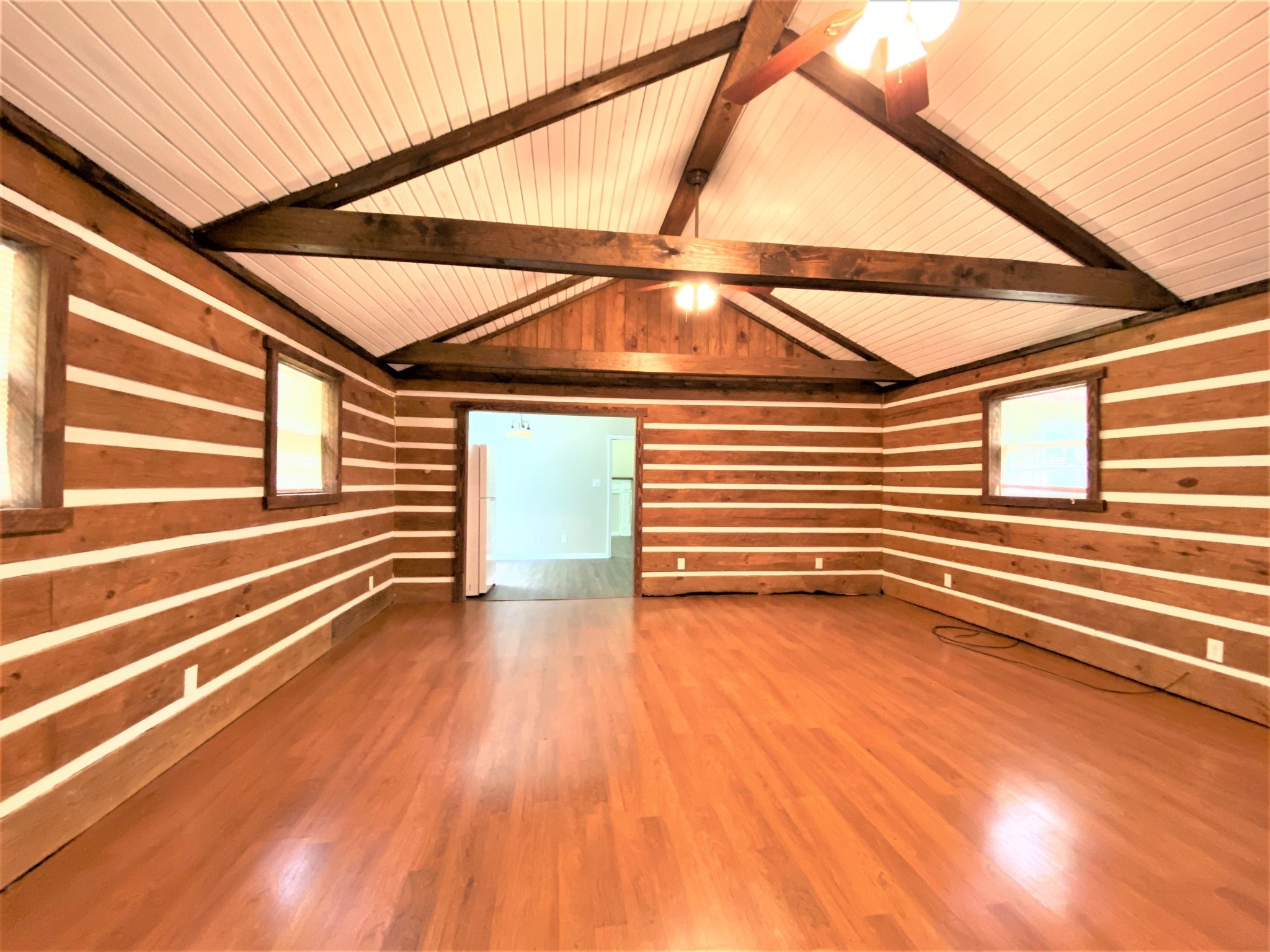 1035 West Point Road Lawrenceburg, TN 38464 - Photo 8 of 42 a view of a room with wooden floor and a ceiling fan