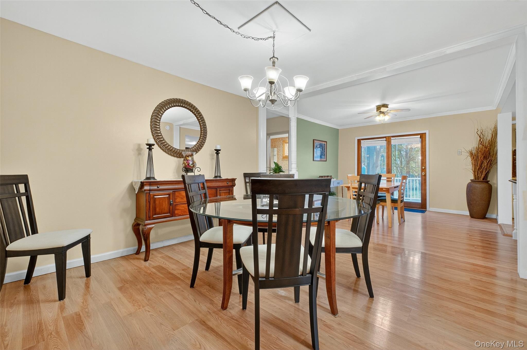 333 Canoe Hill Road Saugerties, NY 12477 - Photo 12 of 34 Dining area featuring light wood-type flooring, ceiling fan, a chandelier, and crown molding