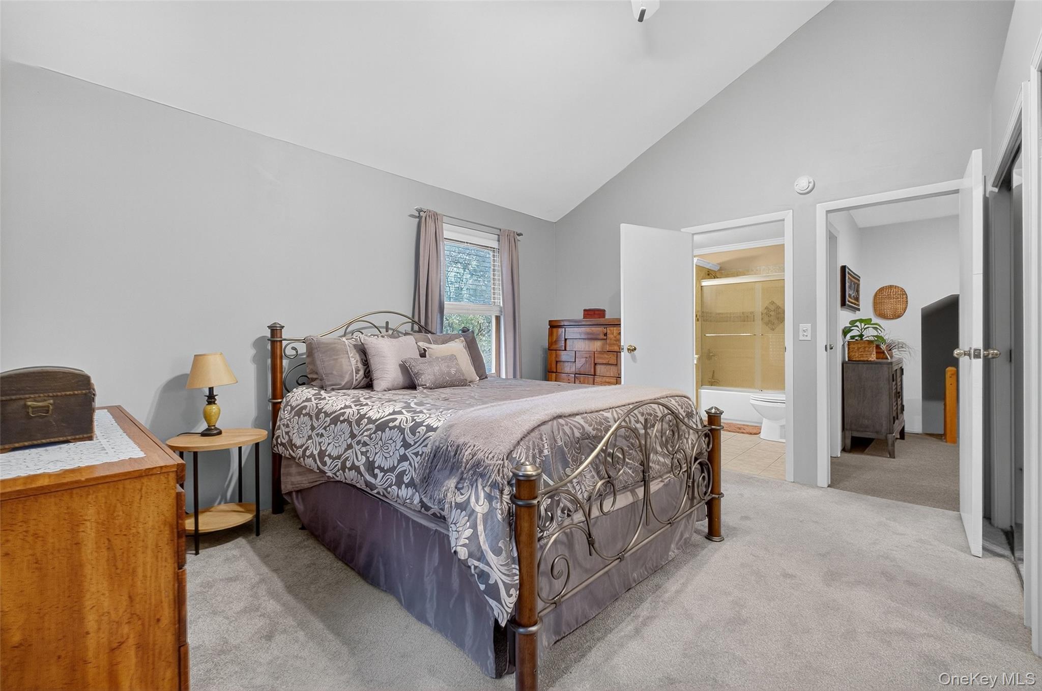 333 Canoe Hill Road Saugerties, NY 12477 - Photo 24 of 34 Bedroom featuring light carpet, ceiling fan, high vaulted ceiling, and connected bathroom