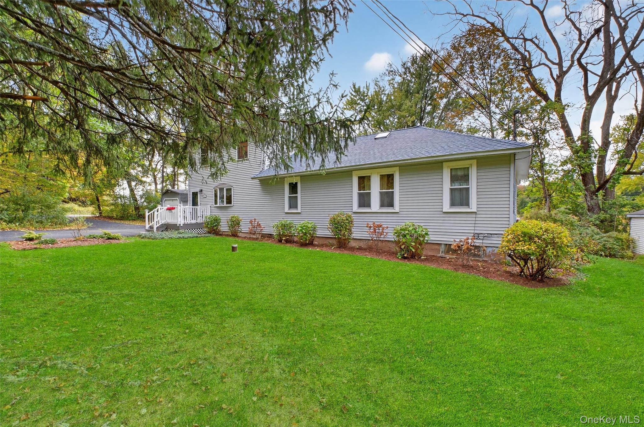 333 Canoe Hill Road Saugerties, NY 12477 - Photo 6 of 34 Rear view of house featuring a lawn and a shingled roof