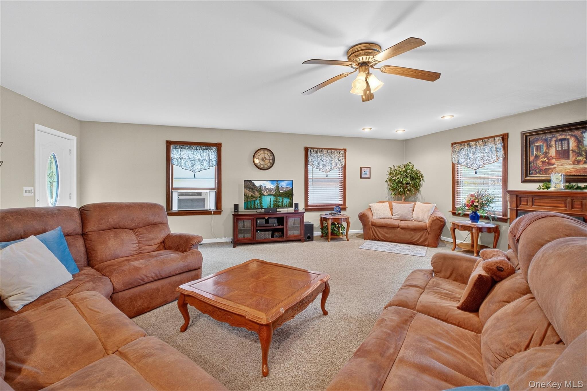 333 Canoe Hill Road Saugerties, NY 12477 - Photo 9 of 34 Carpeted living area with plenty of natural light, a ceiling fan, and cooling unit