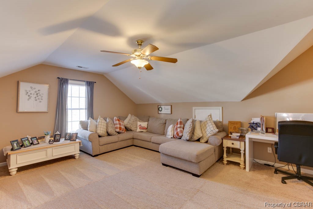 4 Willow Road Hampton, VA 23664 - Photo 40 of 48 Carpeted living room featuring vaulted ceiling and ceiling fan