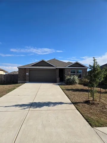a black and white house with a yard