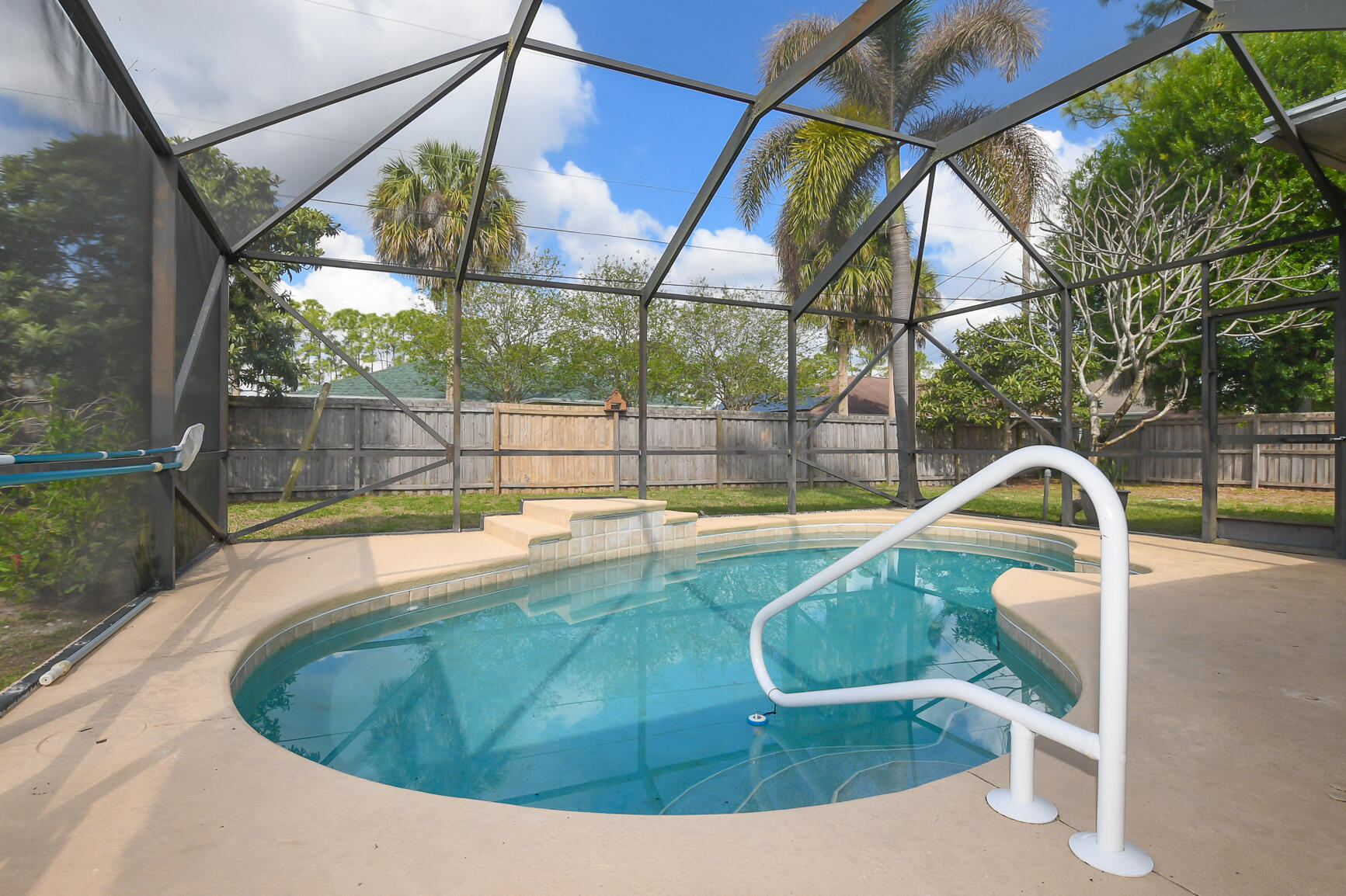1662 Southwest Rutland Street Port St. Lucie, FL 34987 - Photo 11 of 40 a view of outdoor space and swimming pool