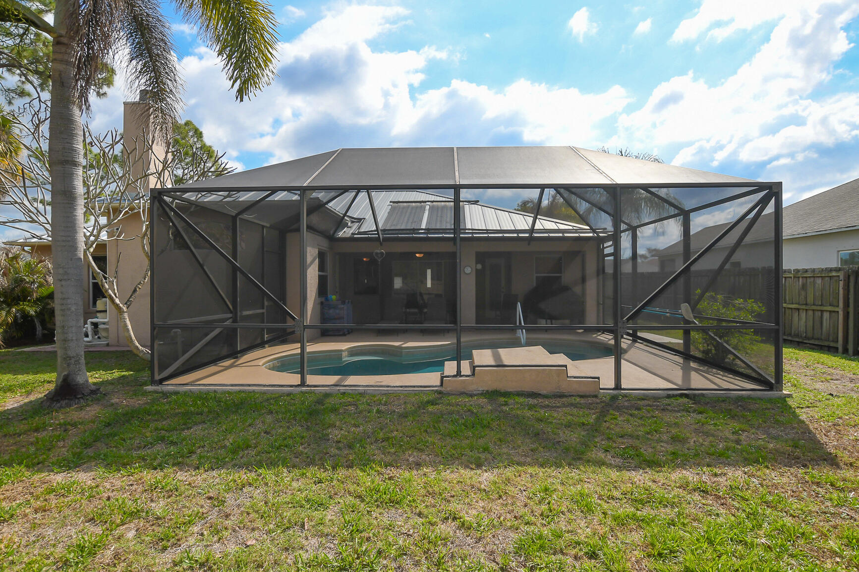 1662 Southwest Rutland Street Port St. Lucie, FL 34987 - Photo 14 of 40 a view of a house with a yard