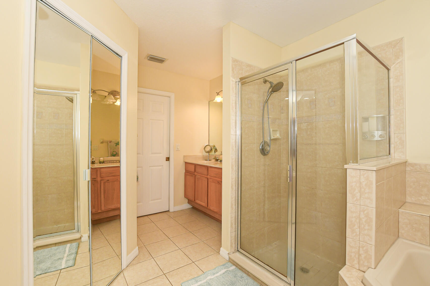 1662 Southwest Rutland Street Port St. Lucie, FL 34987 - Photo 20 of 40 a bathroom with a shower and a glass door