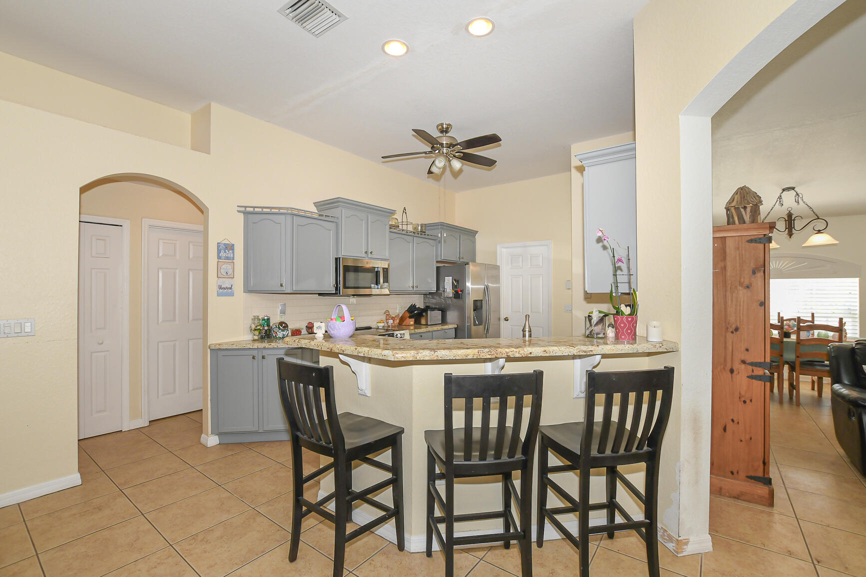 1662 Southwest Rutland Street Port St. Lucie, FL 34987 - Photo 30 of 40 a view of a dining room with furniture