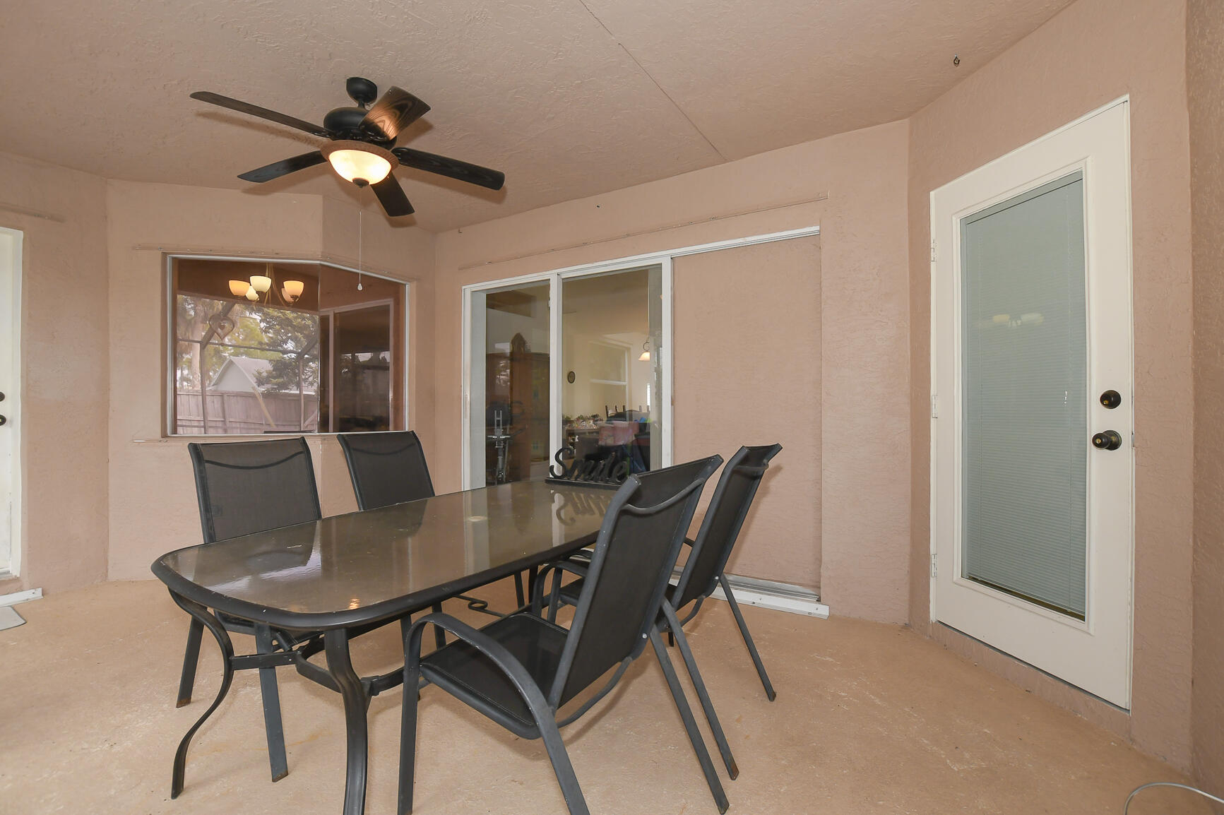 1662 Southwest Rutland Street Port St. Lucie, FL 34987 - Photo 6 of 40 a view of a dining room with furniture and chandelier