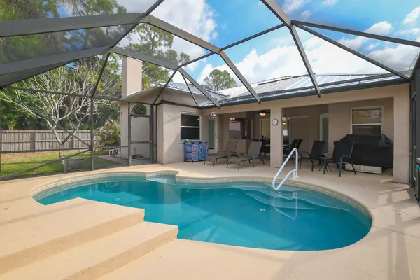 a view of outdoor space and swimming pool