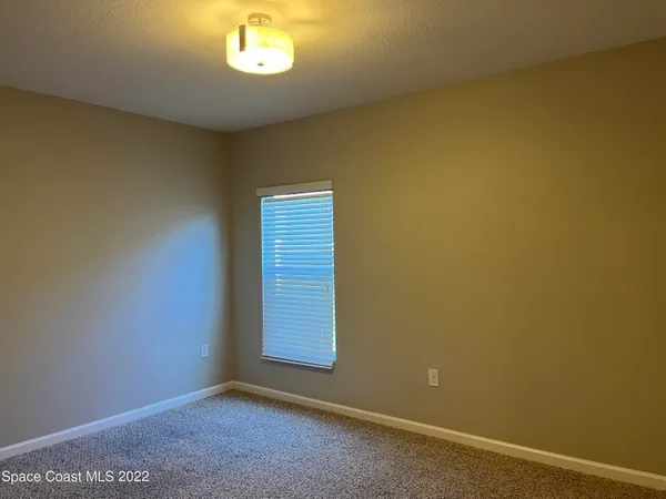 a view of a room that has a window in it