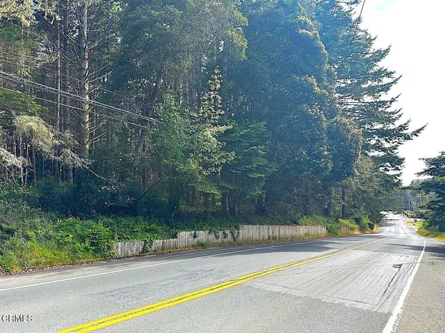 a view of a street with a houses