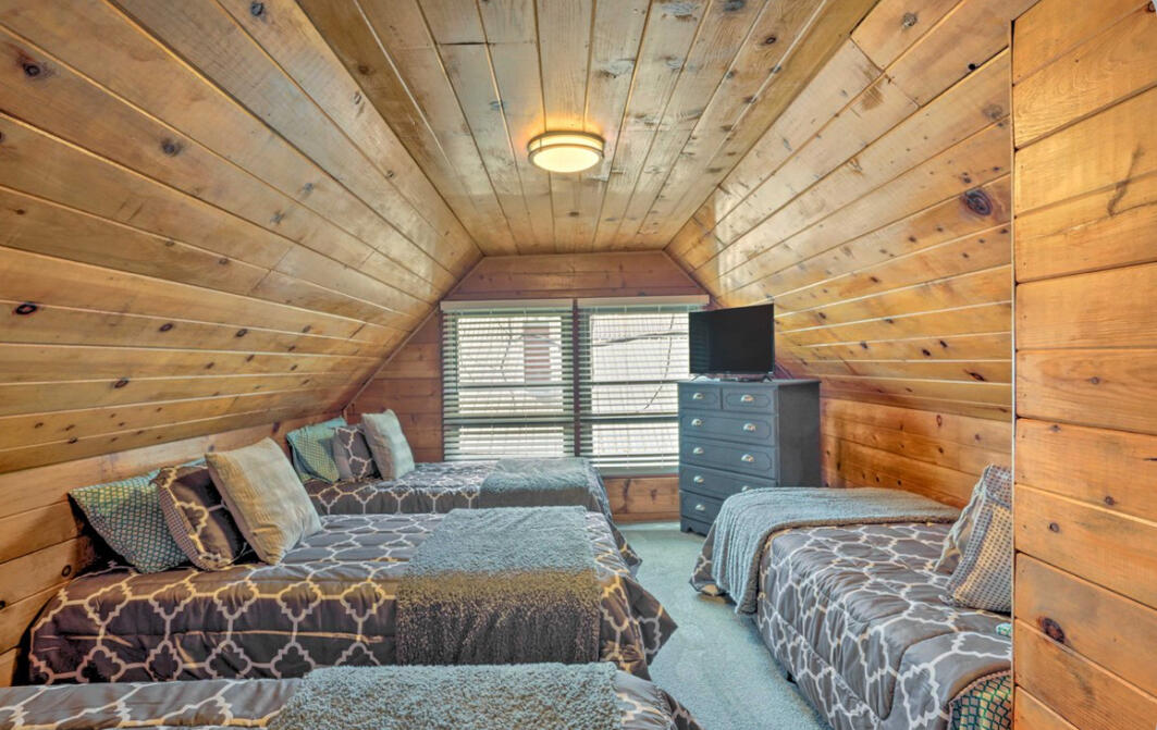 42036 Tollhouse Road Shaver Lake, CA 93664 - Photo 19 of 30 a bedroom with a bed couch and window