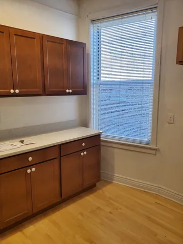 a room with a sink and cabinets