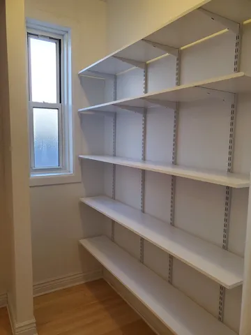 a view of an empty walk in closet