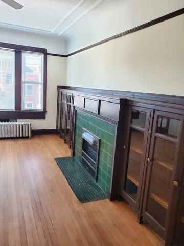 a view of an entryway with wooden floor