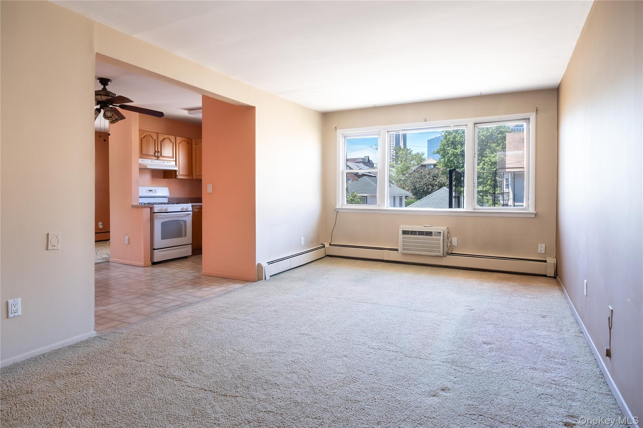 200 Centre Avenue, Unit 3B New Rochelle, NY 10805 - Photo 1 of 1 an empty room with a fireplace and window