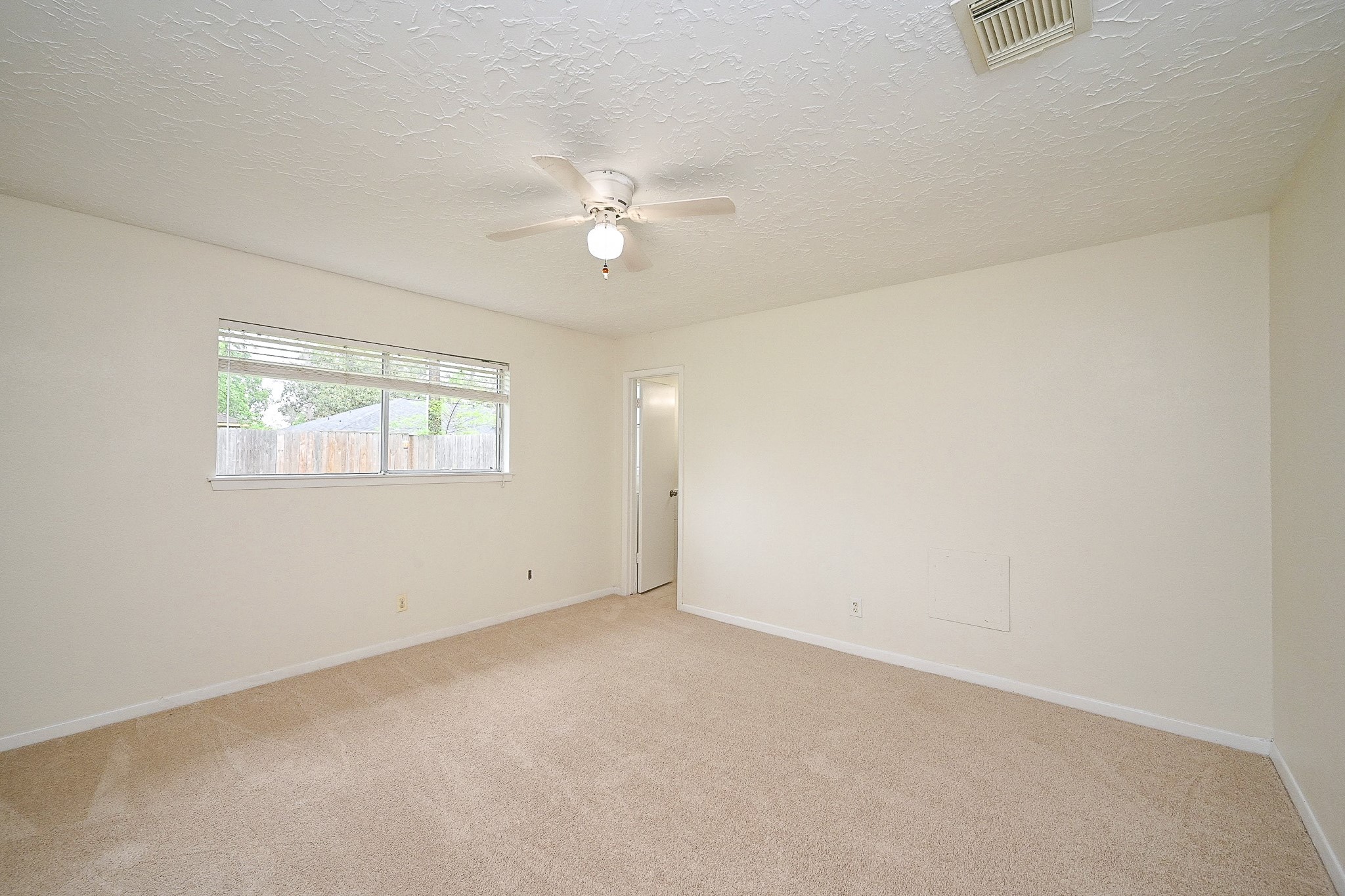 23814 Spring Gum Drive Spring, TX 77373 - Photo 11 of 21 an empty room with windows and fan