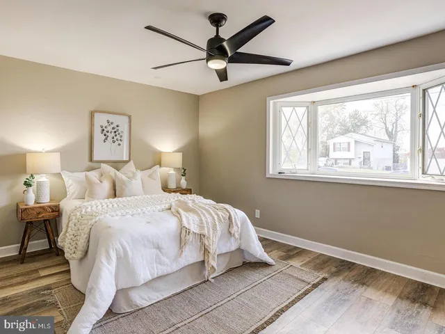 a bed room with a bed and a window