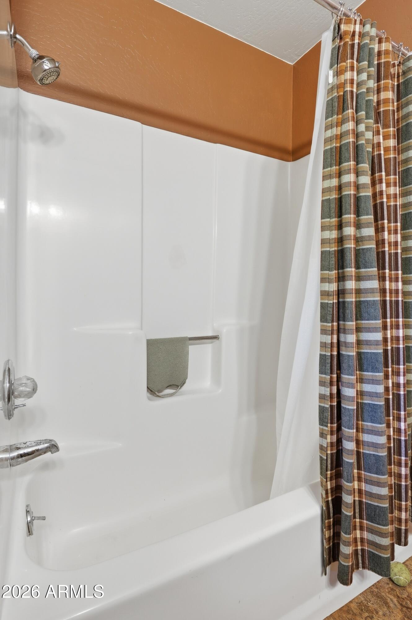 5920 Robin Way Pine, AZ 85544 - Photo 16 of 55 a bathroom with a bathtub and shower