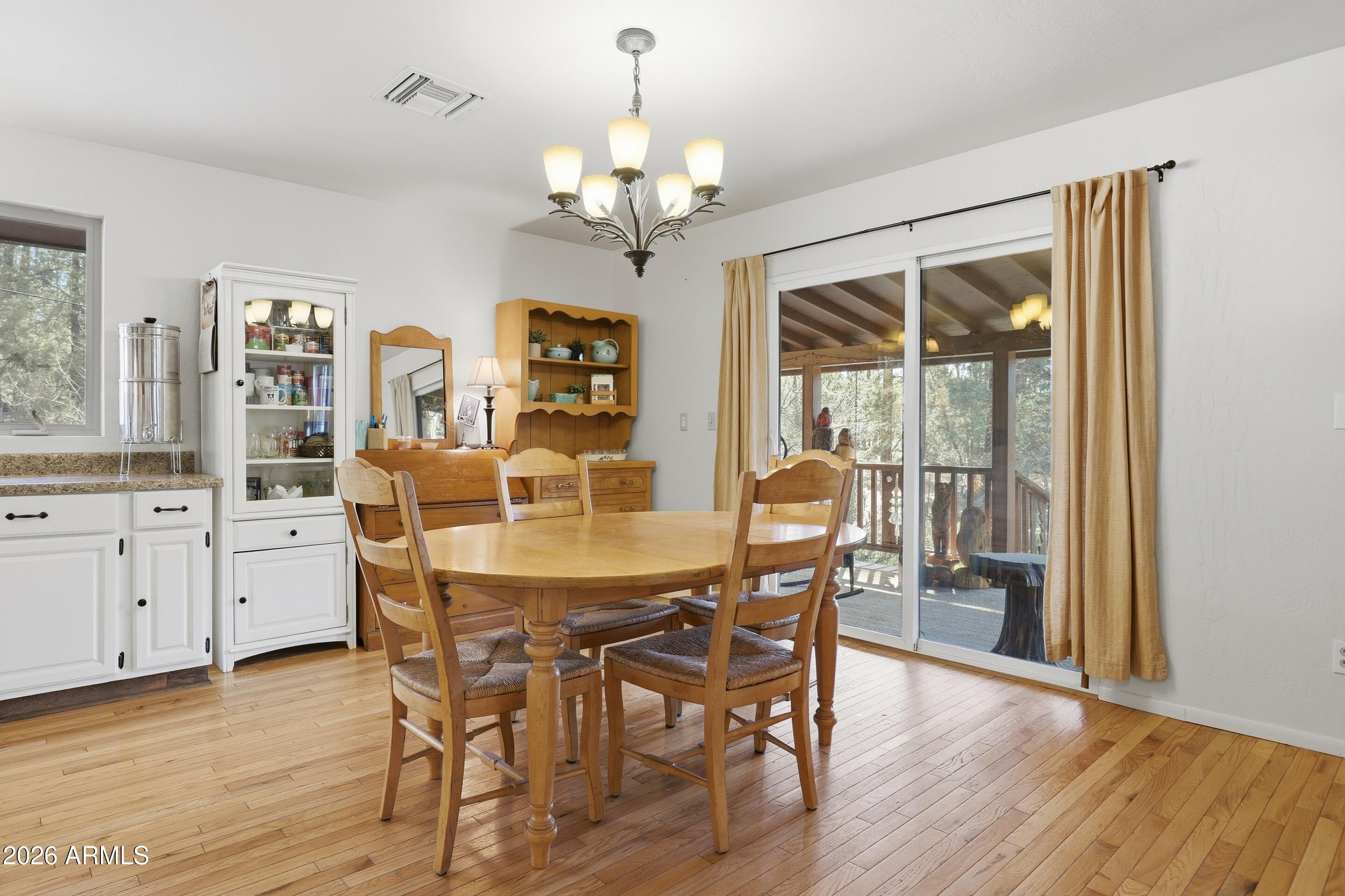 5920 Robin Way Pine, AZ 85544 - Photo 20 of 55 a view of a dining room with furniture window and wooden floor