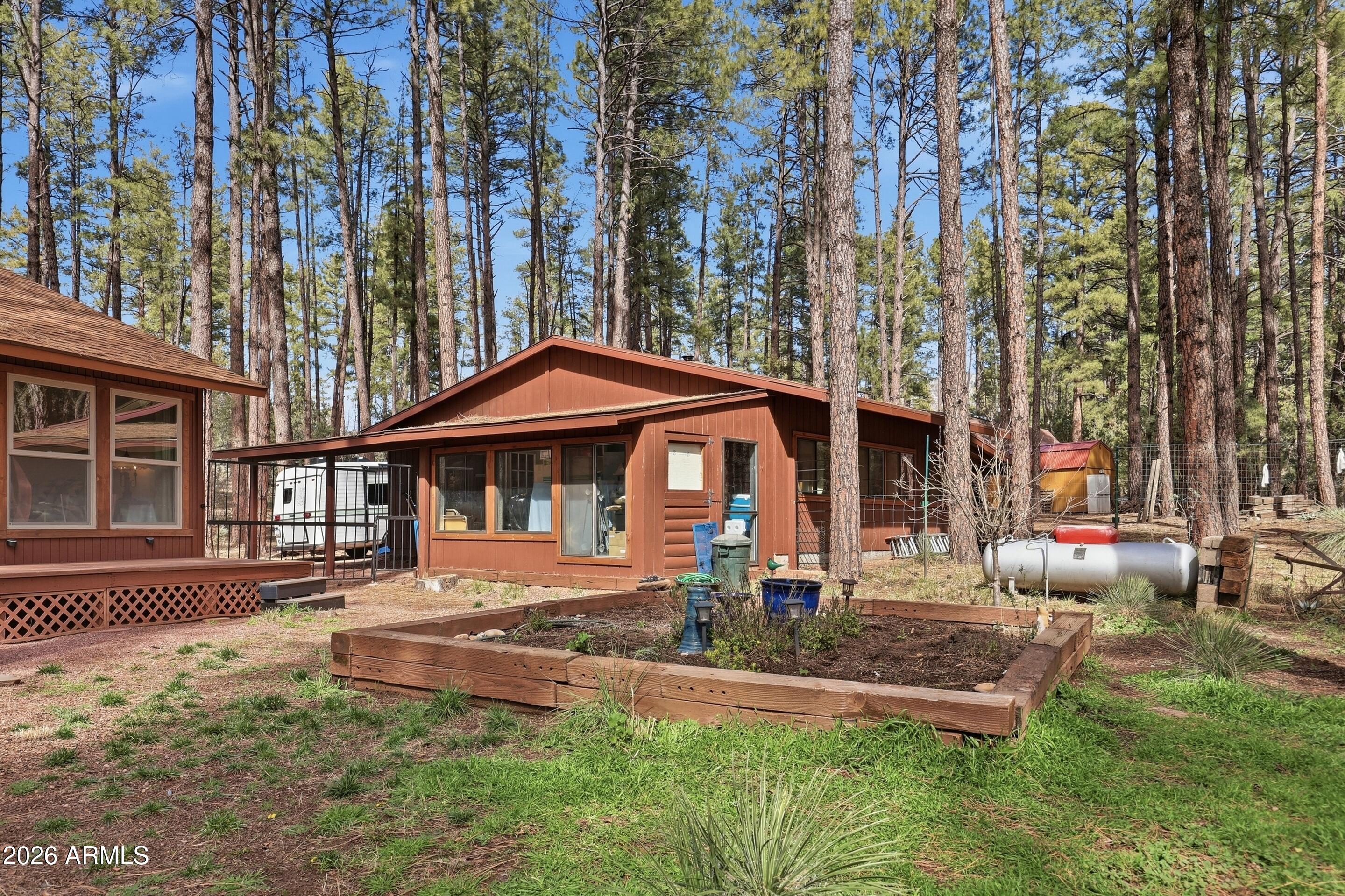 5920 Robin Way Pine, AZ 85544 - Photo 32 of 55 front view of a house with a yard
