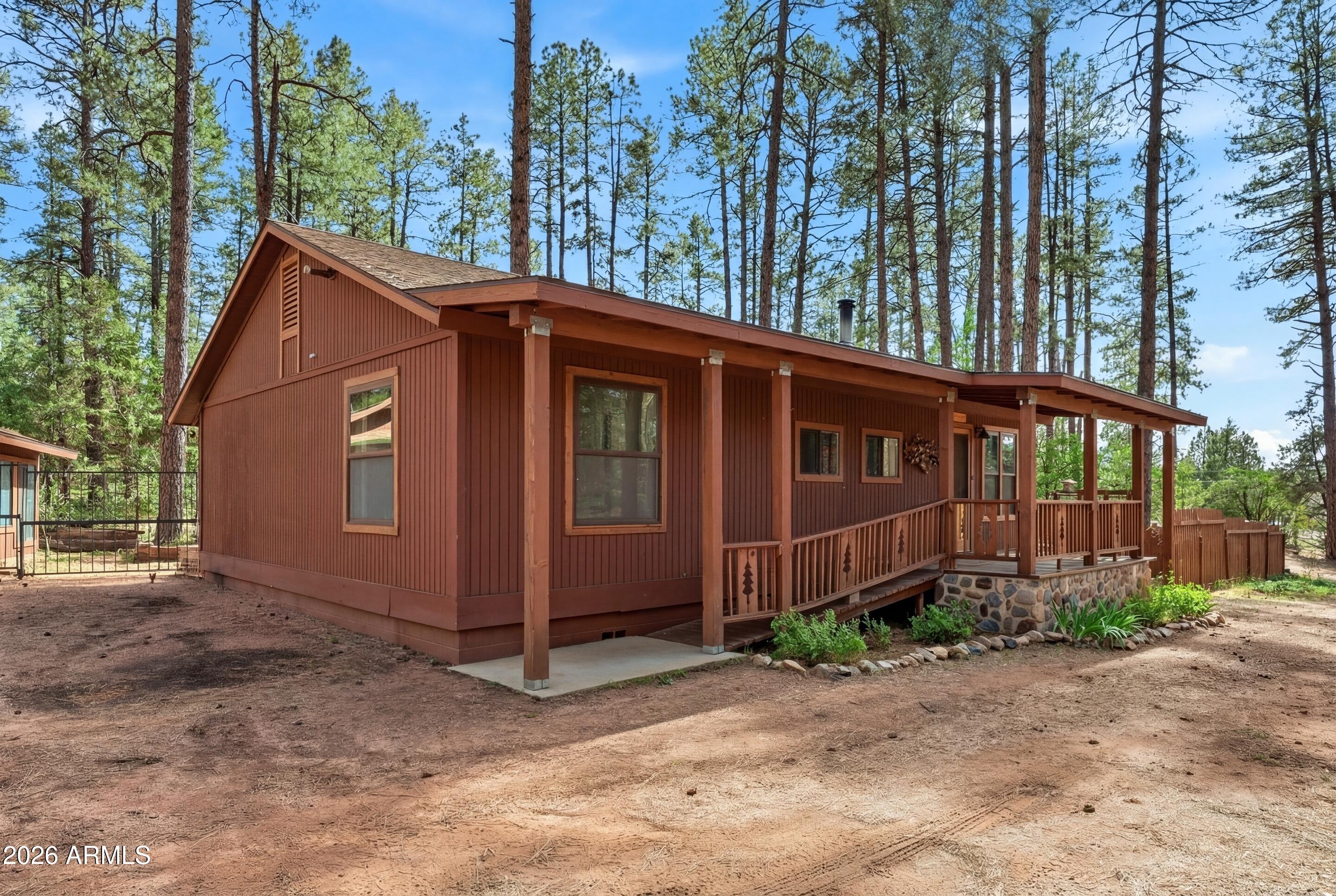 5920 Robin Way Pine, AZ 85544 - Photo 39 of 55 a front view of a house with garden