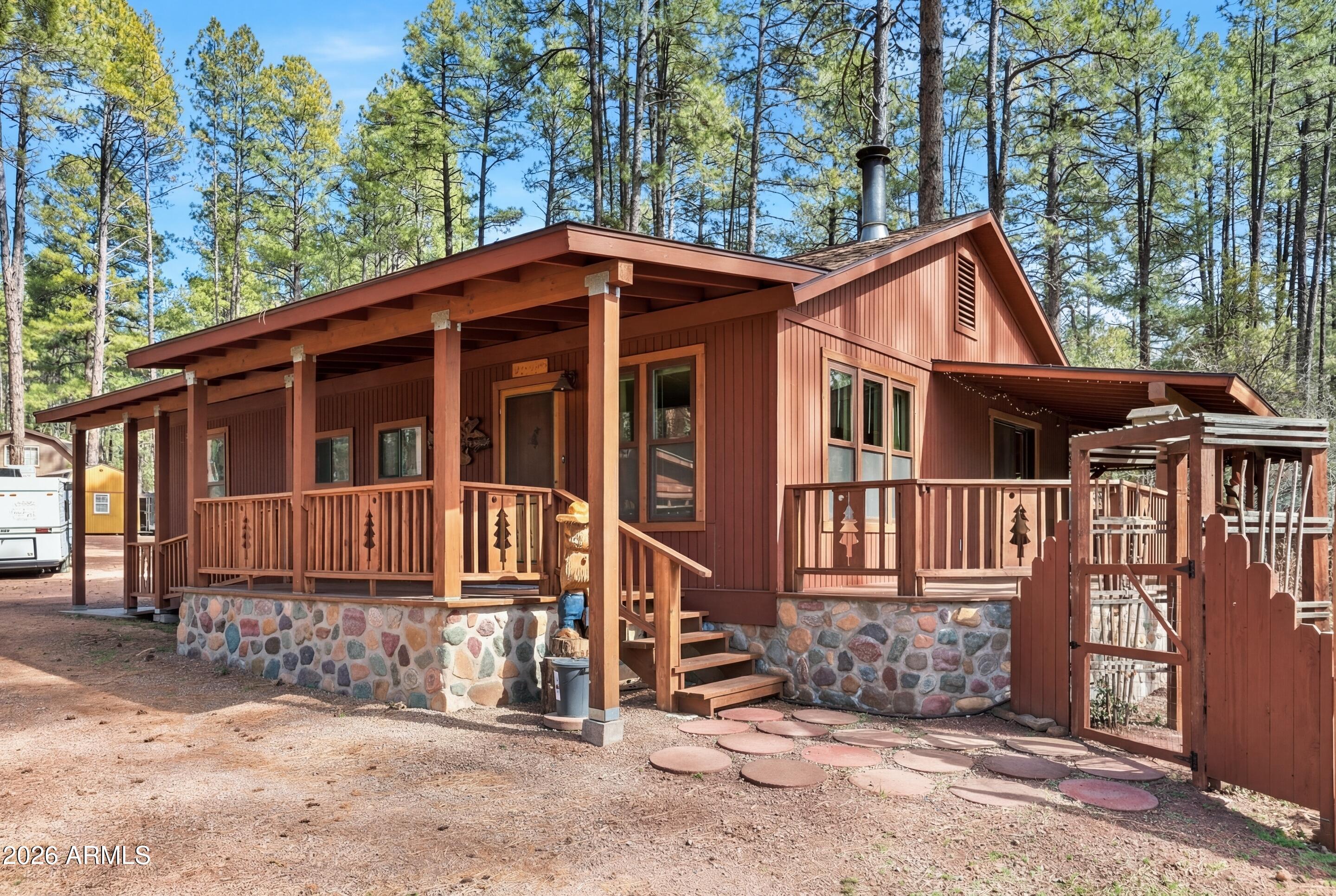 5920 Robin Way Pine, AZ 85544 - Photo 41 of 55 a front view of a house with a yard