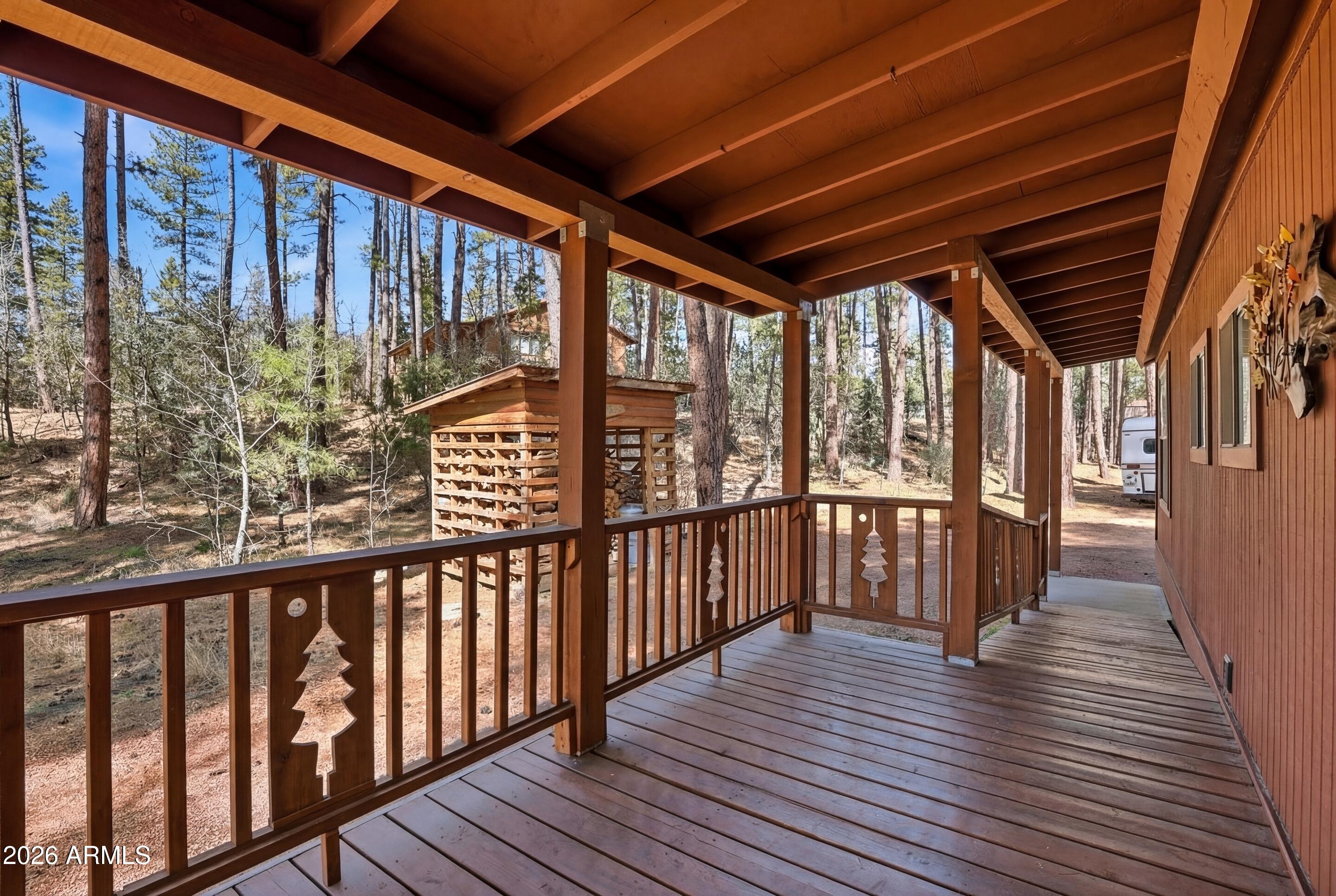 5920 Robin Way Pine, AZ 85544 - Photo 42 of 55 a view of a balcony with wooden floor
