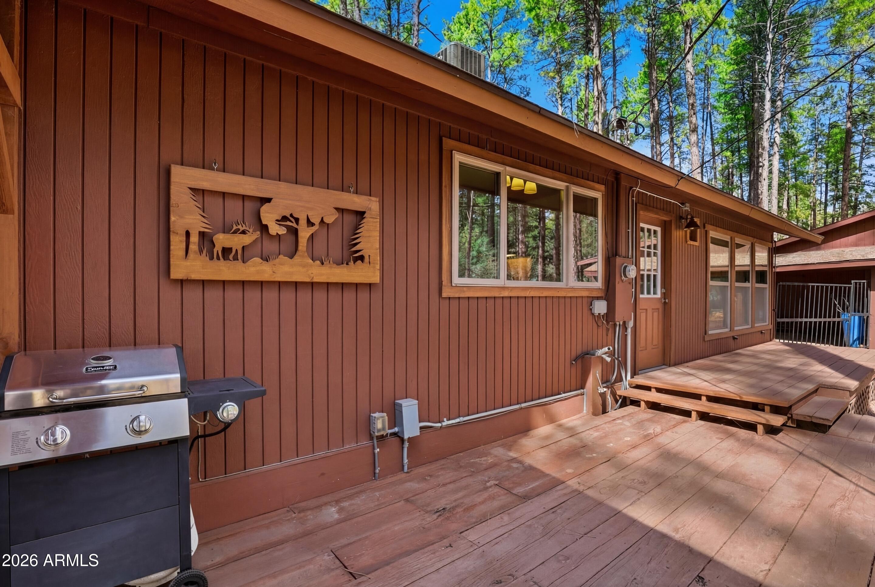 5920 Robin Way Pine, AZ 85544 - Photo 48 of 55 a backyard of a house with barbeque oven and outdoor seating