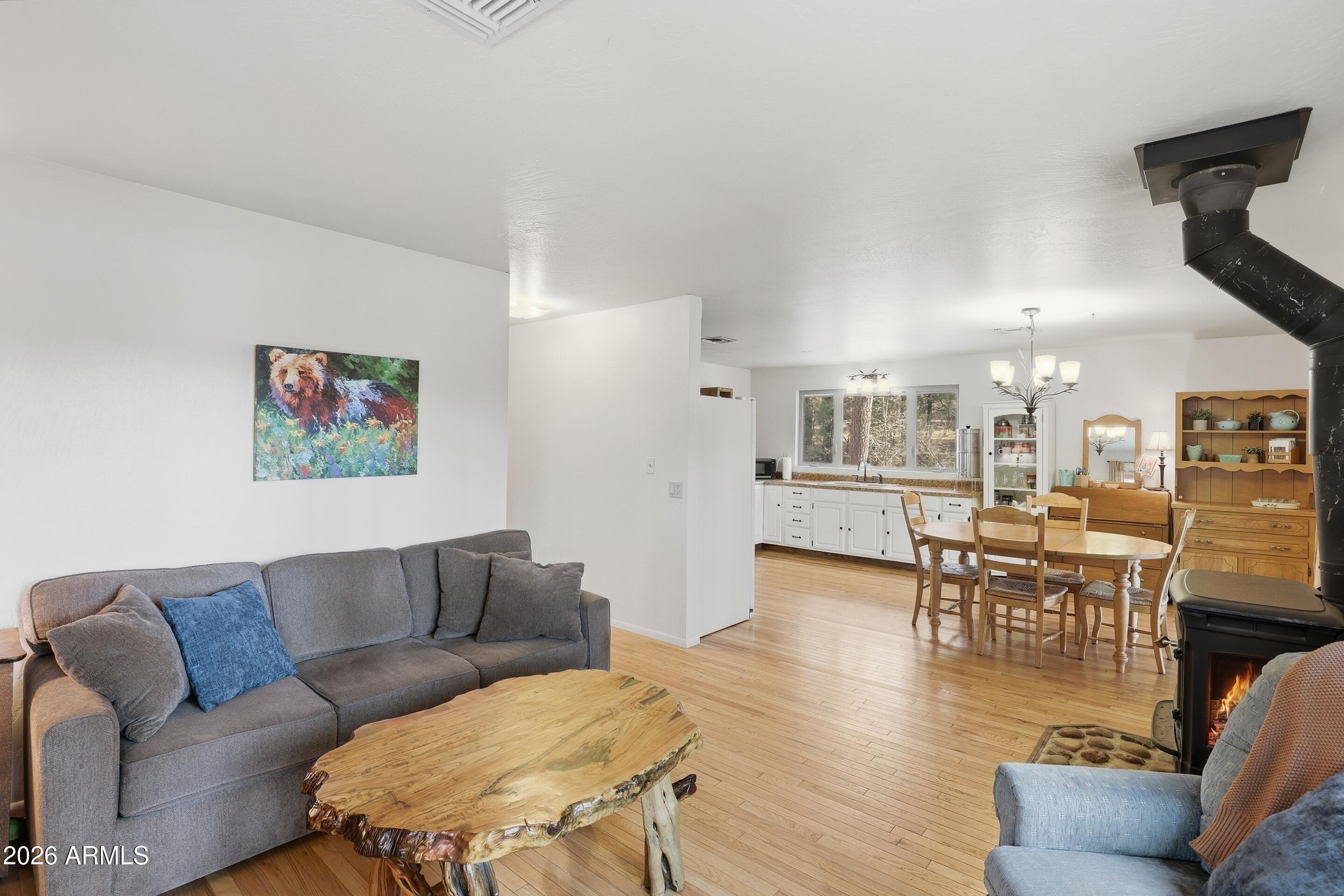 5920 Robin Way Pine, AZ 85544 - Photo 5 of 55 a living room with furniture and wooden floor