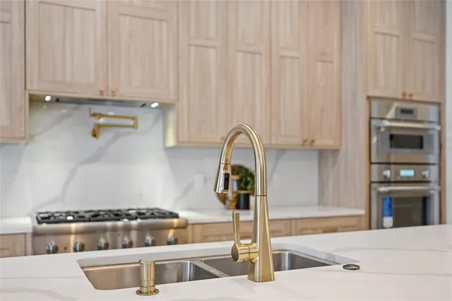 a view of a livingroom with furniture and a kitchen